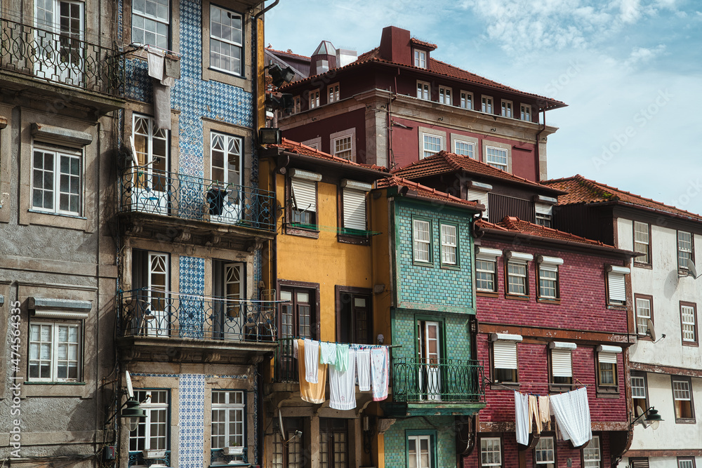 Colorful facades with traditional portuguese glazed tile in Old town of Porto, Portugal.