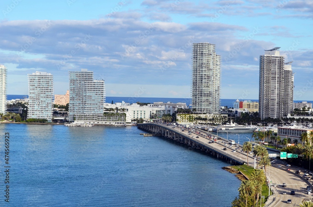 Eastern end of the MacArthur Causeway,and luxury Miami Beach,Florida condo towers overlooking Biscayne Bay . Eastern end of the MacArthur Causeway,and luxury Miami Beach,Florida condo towers overlooking Biscayne Bay .