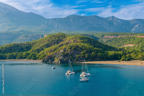 sea bay among the mountains with some yachts, view of the South Harbor of the ancient city of Phaselis, Turkey photo