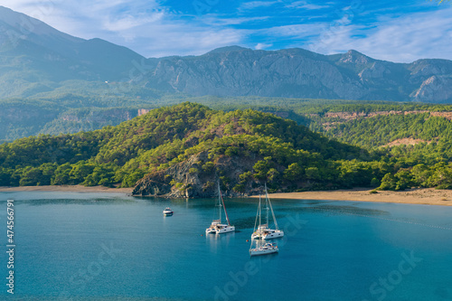 Fototapeta Naklejka Na Ścianę i Meble -  sea bay among the mountains with some yachts, view of the South Harbor of the ancient city of Phaselis, Turkey