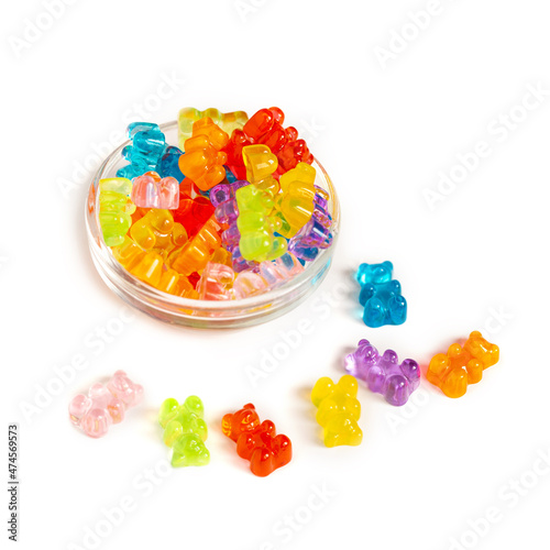 Gummy multicolored bears on a white isolated background. Sweets for children. Bright, multi-colored sweets.