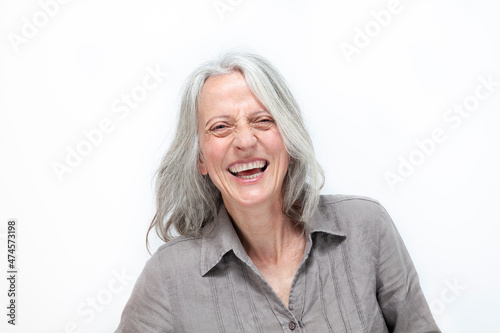 mature beautiful woman with gray hair, laughing out loud