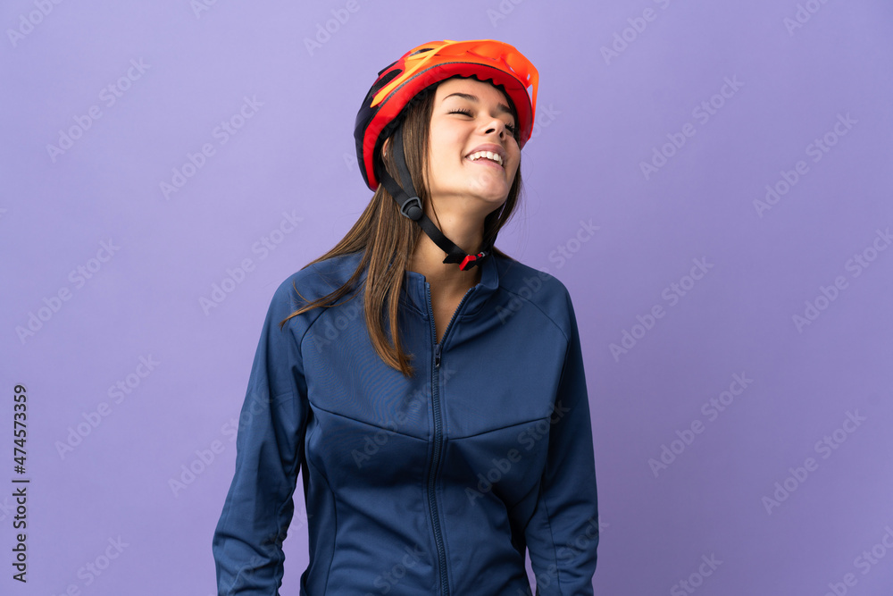 Teenager cyclist girl laughing Teenager cyclist girl laughing