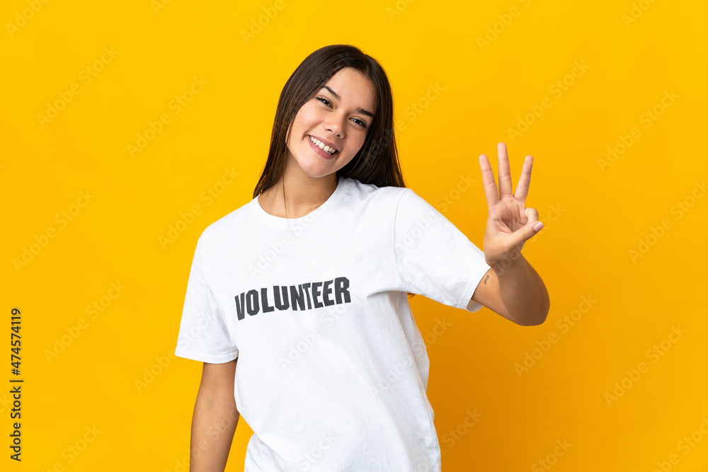 Teenager volunteer girl happy and counting three with fingers