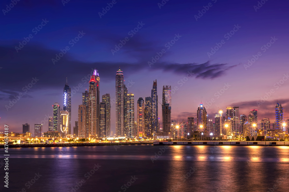 Sunset view of Dubai Marina and famous Jumeirah beach skyline  Emirates