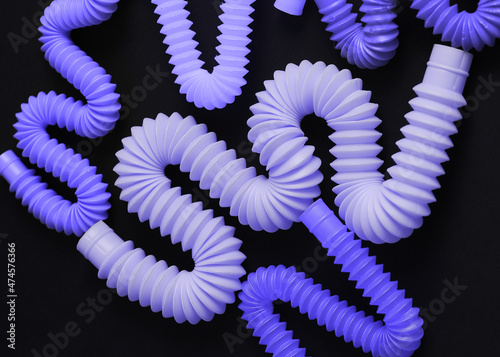 trendy toys pop tube in very peri color on dark background