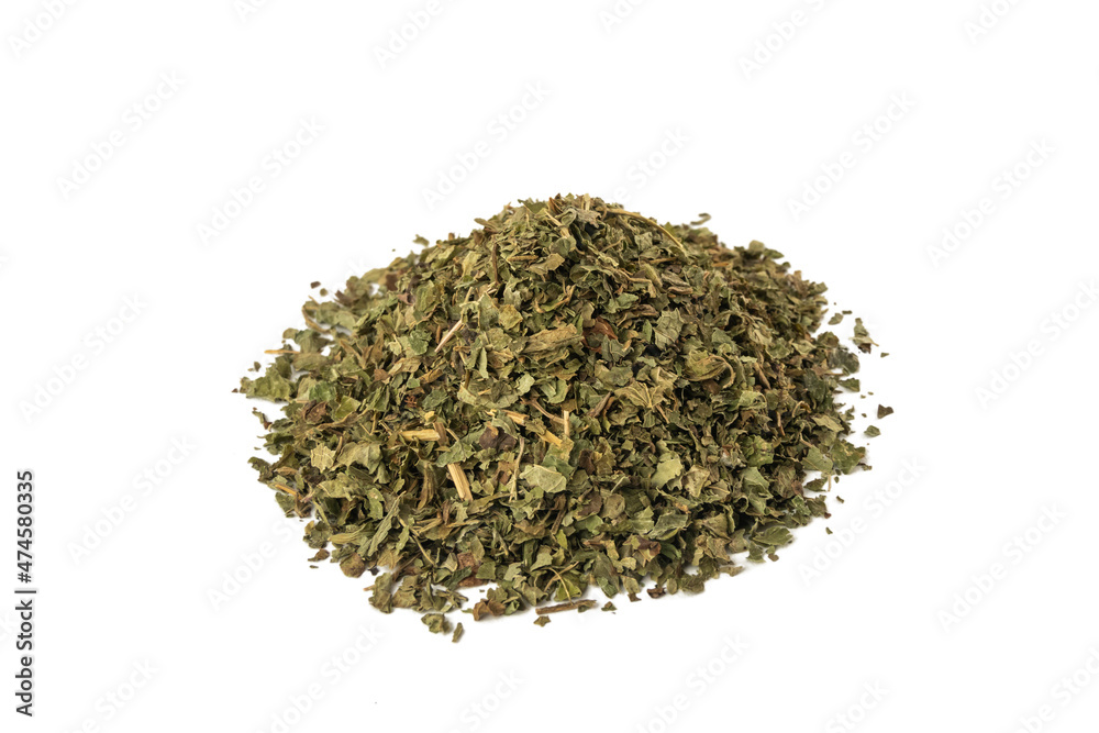 Dried Lemon balm (Melissa officinalis) herb heap isolated on white background. Dried Lemon balm (Melissa officinalis) herb heap isolated on white background.