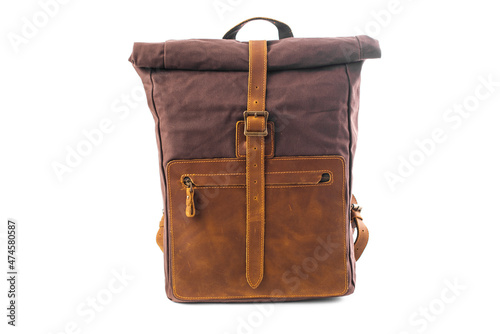 Canvas Backpack isolated on white background. Burgundy with brown bag. Hand made backpack for travelers.