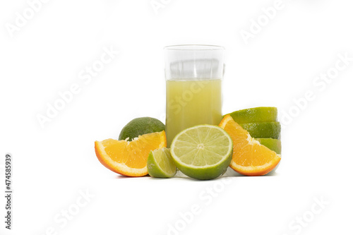 Glass of lime juice and sliced lime fruits  isolated on white background.