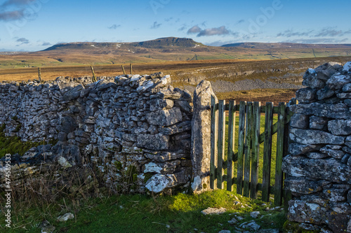 Hill walking the Norber Eratics around Austwick in Craven in  the Yorkshire Dales photo