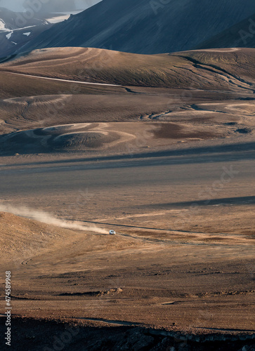 aerial view of a car driving through the Icelandic Highlands offroad 