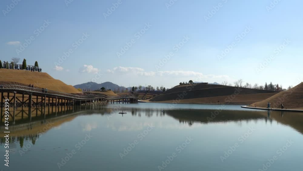Lake Garden with Bridge of Dreams, Haeryeong, Bonghwa Hills skyline in Suncheonman Bay National Garden, Suncheon, South Korea Lake Garden with Bridge of Dreams, Haeryeong, Bonghwa Hills skyline in Suncheonman Bay National Garden, Suncheon, South Korea