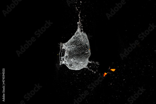 Burst water balloon background © taffpixture