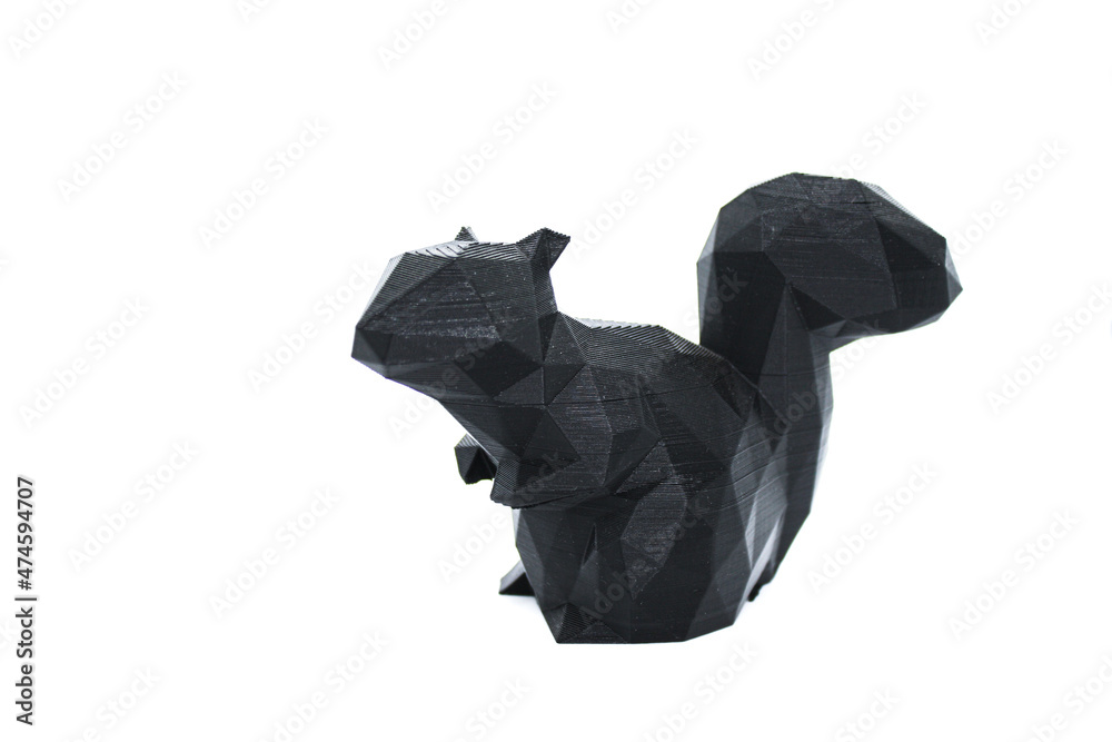 3d printed black faceted squirrel over white background