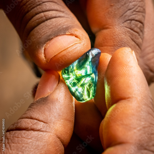 Rough sapphire gemstones handheld photo