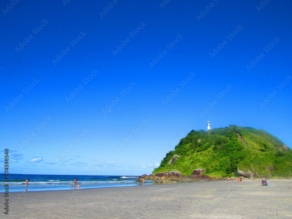 Fototapeta premium lighthouse on the coast with beach
