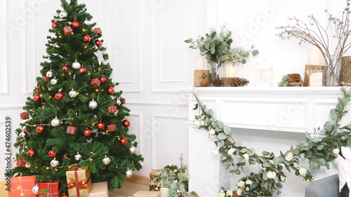 Christmas tree decorated holiday winter xmas celebration present gift to family decorate with ornament golden ball in cozy living room. Merry Christmas and happy new year festival traditional concept.