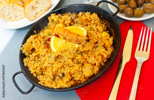 Spainsh dish seafood paella with rice, shrimps and mussels. High quality photo