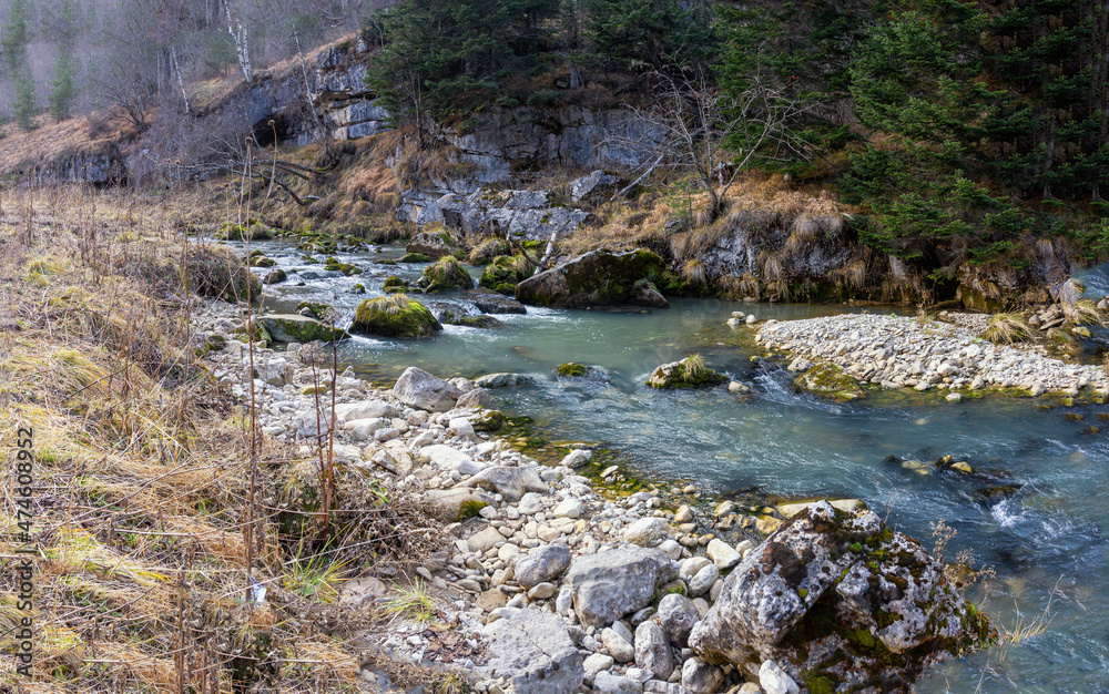 traveling along the bed of a mountain river, an autumn day, nature is preparing for winter hibernation. traveling along the bed of a mountain river, an autumn day, nature is preparing for winter hibernation.