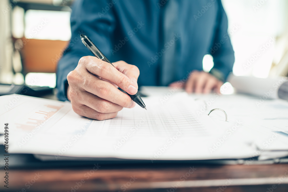 Businessman working on office desk and analyzing new project of accounting finance. Investment, Financial advisor, budget, plan and accounting concept. Businessman working on office desk and analyzing new project of accounting finance. Investment, Financial advisor, budget, plan and accounting concept.