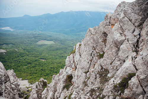 beautiful landscape view from the top of the mountain to the green forest