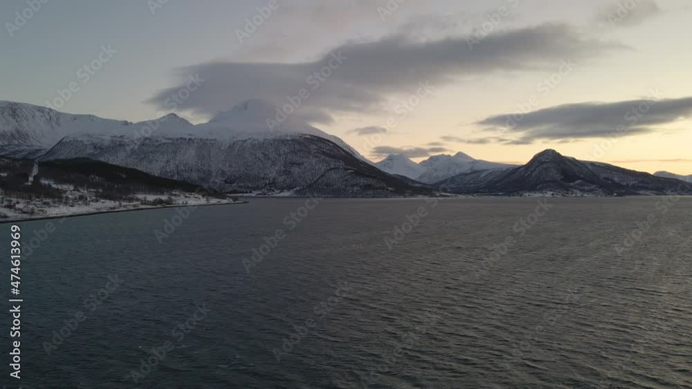White Mountain Peaks Of Northern Norway In A Winter Sunset - aerial shot White Mountain Peaks Of Northern Norway In A Winter Sunset - aerial shot