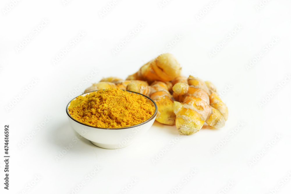 Fresh turmeric on white background,raw material for cooking. Close up. Fresh turmeric on white background,raw material for cooking. Close up.