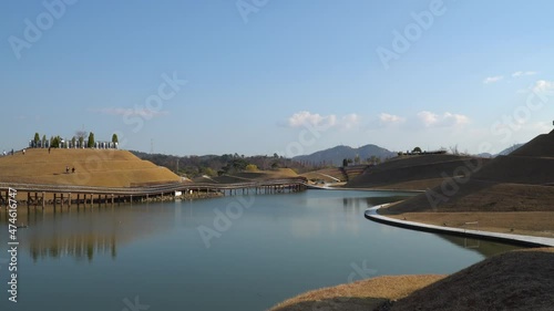 Suncheonman Bay Lake Garden in Autumn, Visitors walking on Bonghwa Hill spiral walkway trails and Bridge of Dreams, Suncheon city, Jeonnam, South Korea photo