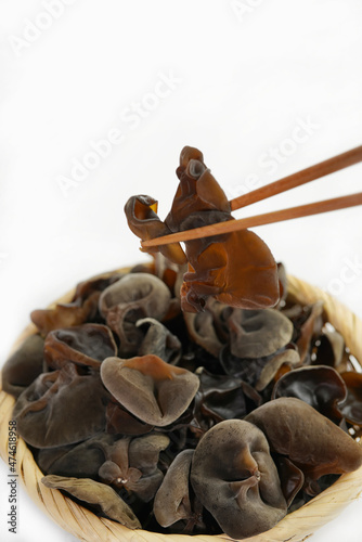 Fresh wood ear nushroom on white background,raw material for cooking. Close up. © LHG