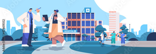 mix race doctors in uniform discussing during meeting neat modern hospital building healthcare medicine concept