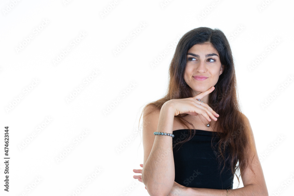 Young woman cheerful happy girl smiling laughing looking side camera and hand on chin over white background Young woman cheerful happy girl smiling laughing looking side camera and hand on chin over white background