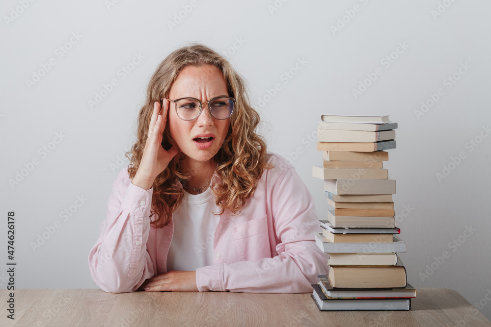 college girl with glasses has headache just thinking how much she has to learn college girl with glasses has headache just thinking how much she has to learn