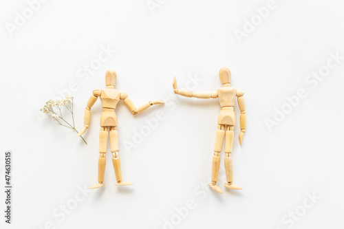 Man and woman connection. Couple of wooden mannequin figures.