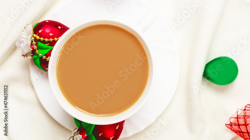 Christmas and New Year cozy holiday composition with christmas decorations  scarf  mugs with cocoa or offee  gifts  on white background. Flat lay  top view