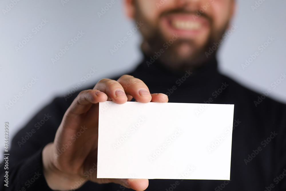 small white piece of paper in his hand man small white piece of paper in his hand man