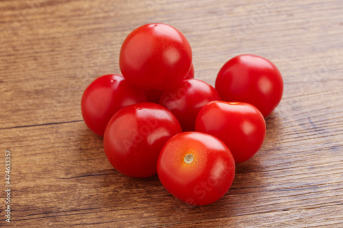 Ripe juicy cherry tomatoes heap