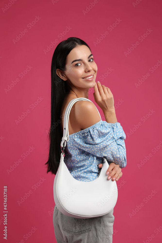 Fashionable young woman with stylish bag on pink background Fashionable young woman with stylish bag on pink background