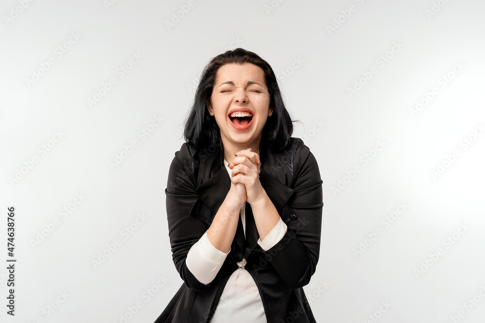 Worried businesswoman praying for luck, amazed and opening mouth, standing against white background. Business and praying concept Worried businesswoman praying for luck, amazed and opening mouth, standing against white background. Business and praying concept