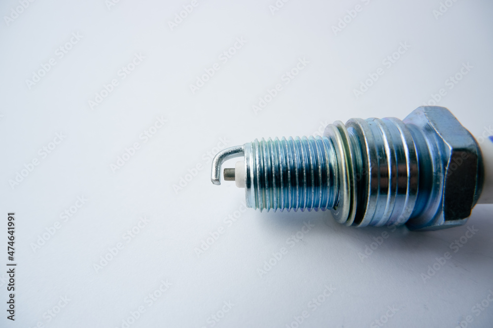 Auto parts. Car spark plugs. Spark plugs of a gasoline internal combustion engine. Space for text Auto parts. Car spark plugs. Spark plugs of a gasoline internal combustion engine. Space for text