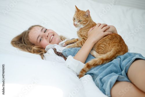 Girl teenager with a cat. High quality photo