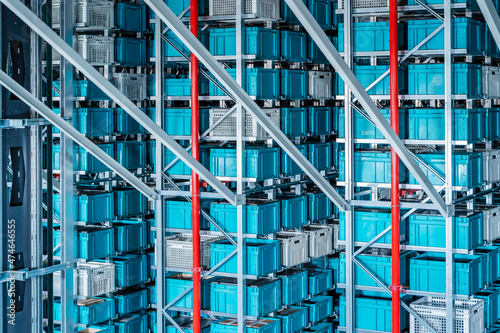 Blue containers in automatized high rack at warehouse photo