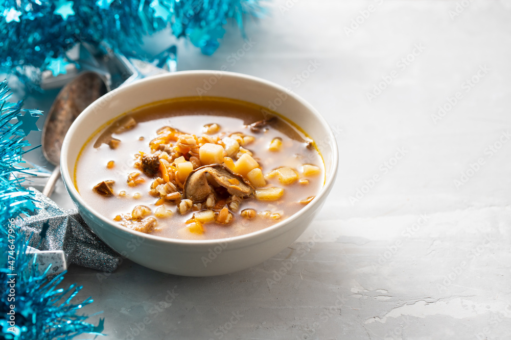 Fototapeta premium fresh mushrooms soup in small brown bowl