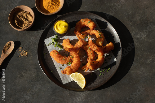 Dish of battered prawns with spices photo