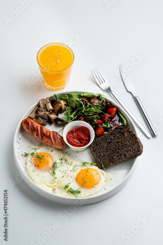 A whole portion of english breakfast, on white dish, top view, modern menu design