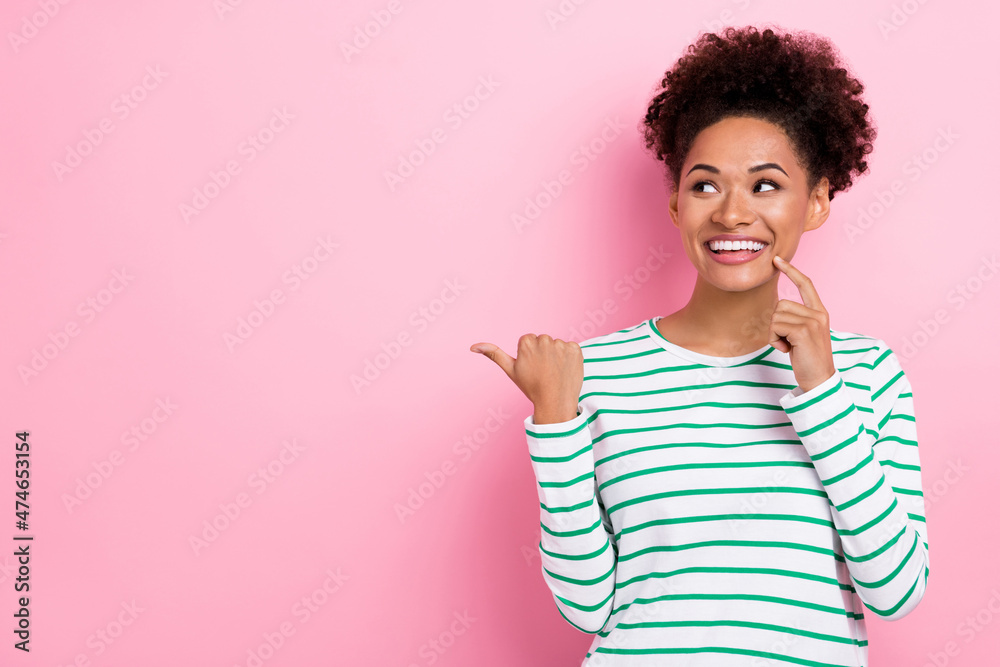 Photo of funny bun hairdo millennial lady index look empty space wear white shirt isolated on pink color background