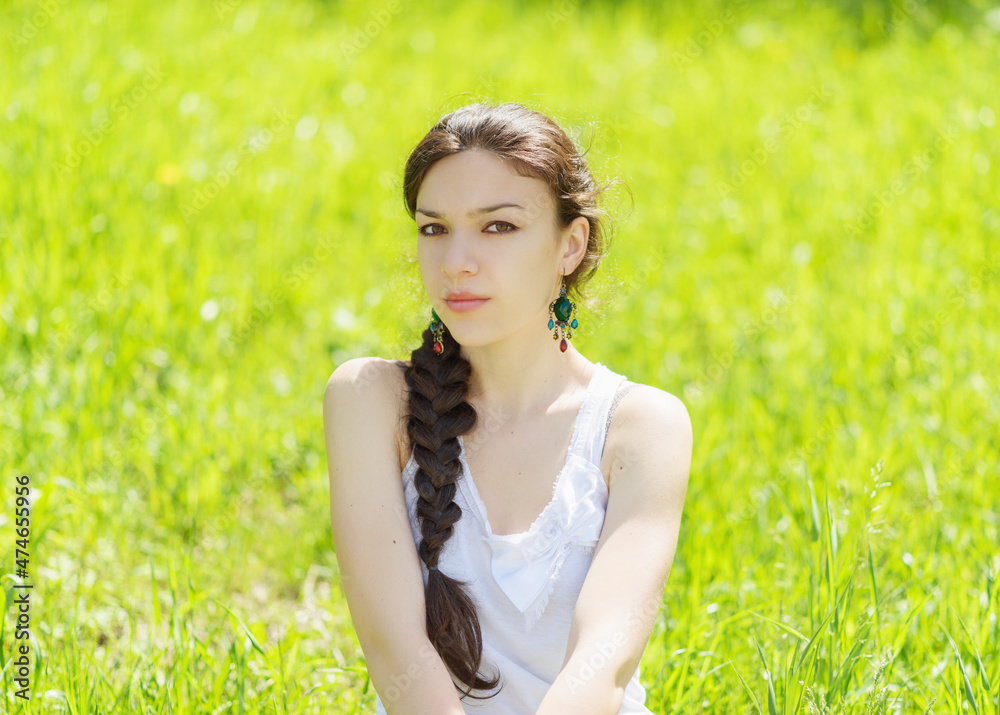 Portrait of beautiful young woman in city park. Portrait of beautiful young woman in city park.