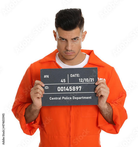 Fotobehang Mug shot of prisoner in orange jumpsuit with board on white background, front vi