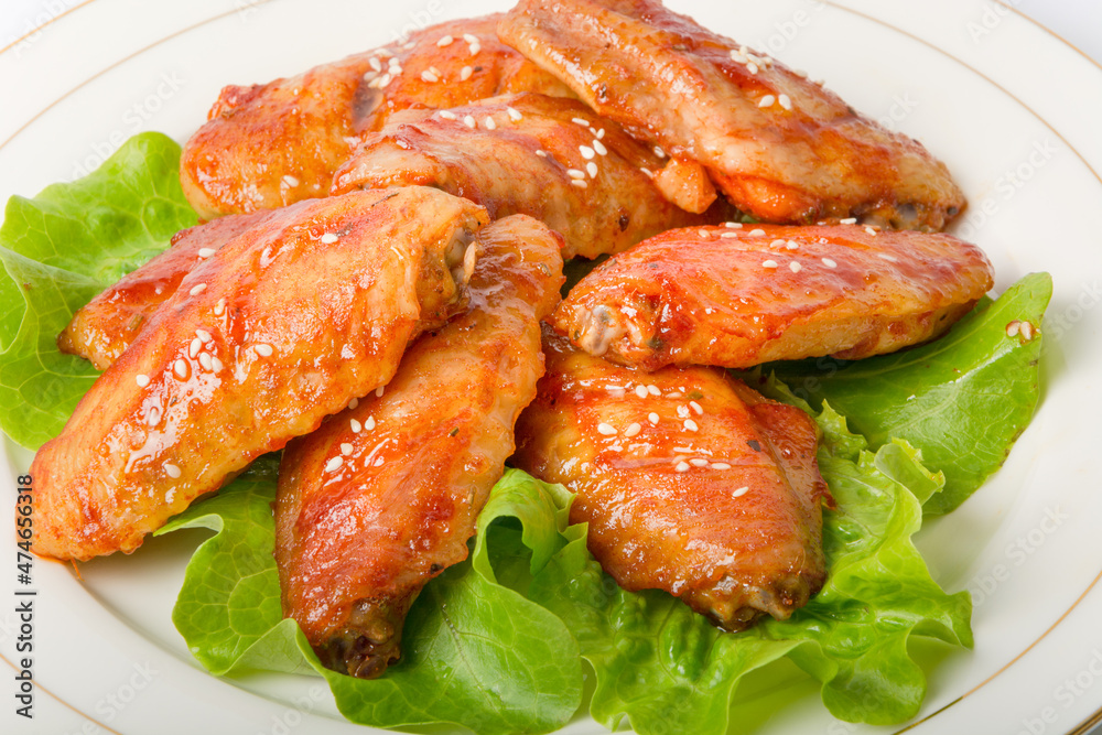 A plate of Orleans grilled chicken wings A plate of Orleans grilled chicken wings