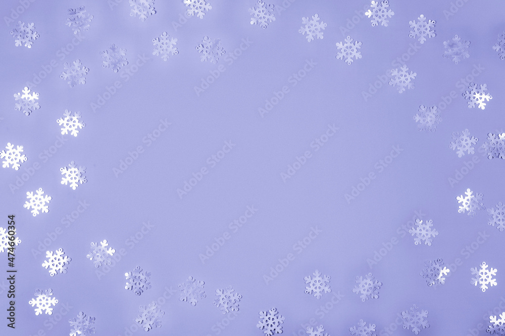 Abstract Christmas background in very peri color 2022. Violet confetti on a violet background, copy space for text Abstract Christmas background in very peri color 2022. Violet confetti on a violet background, copy space for text