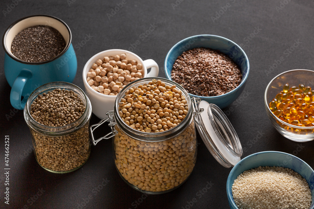 Source of vitamin E and nutrients in bowls on the table, copy space